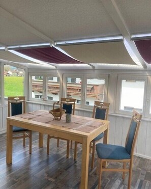 Enjoy meals in this spacious dining area with a wooden table and six comfortable chairs.