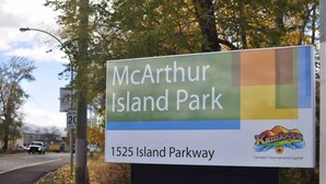 A sign for McArthur Island Park with the address 1525 Island Parkway. - Feel at home in This 2 Bedroom Basement Suite (Kamloops)