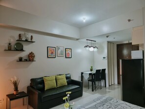 Standard Studio, 1 Queen Bed, Balcony | Living area | LED TV - One Palm Tree Villas - Unit 3i and 3j (Pasay)