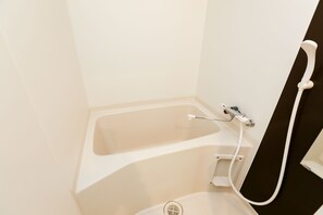 Separate tub and shower, free toiletries, hair dryer, slippers