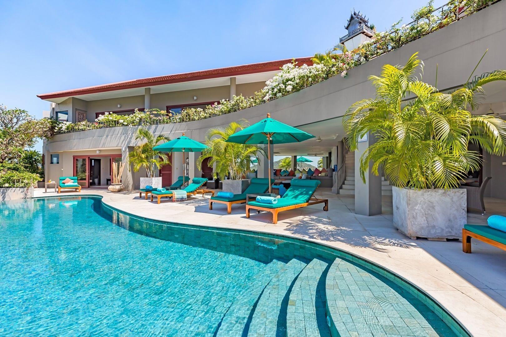 An infinity pool, pool loungers