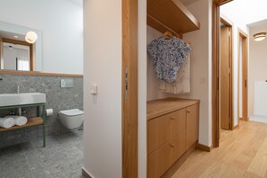 Shower, hair dryer, towels, toilet paper