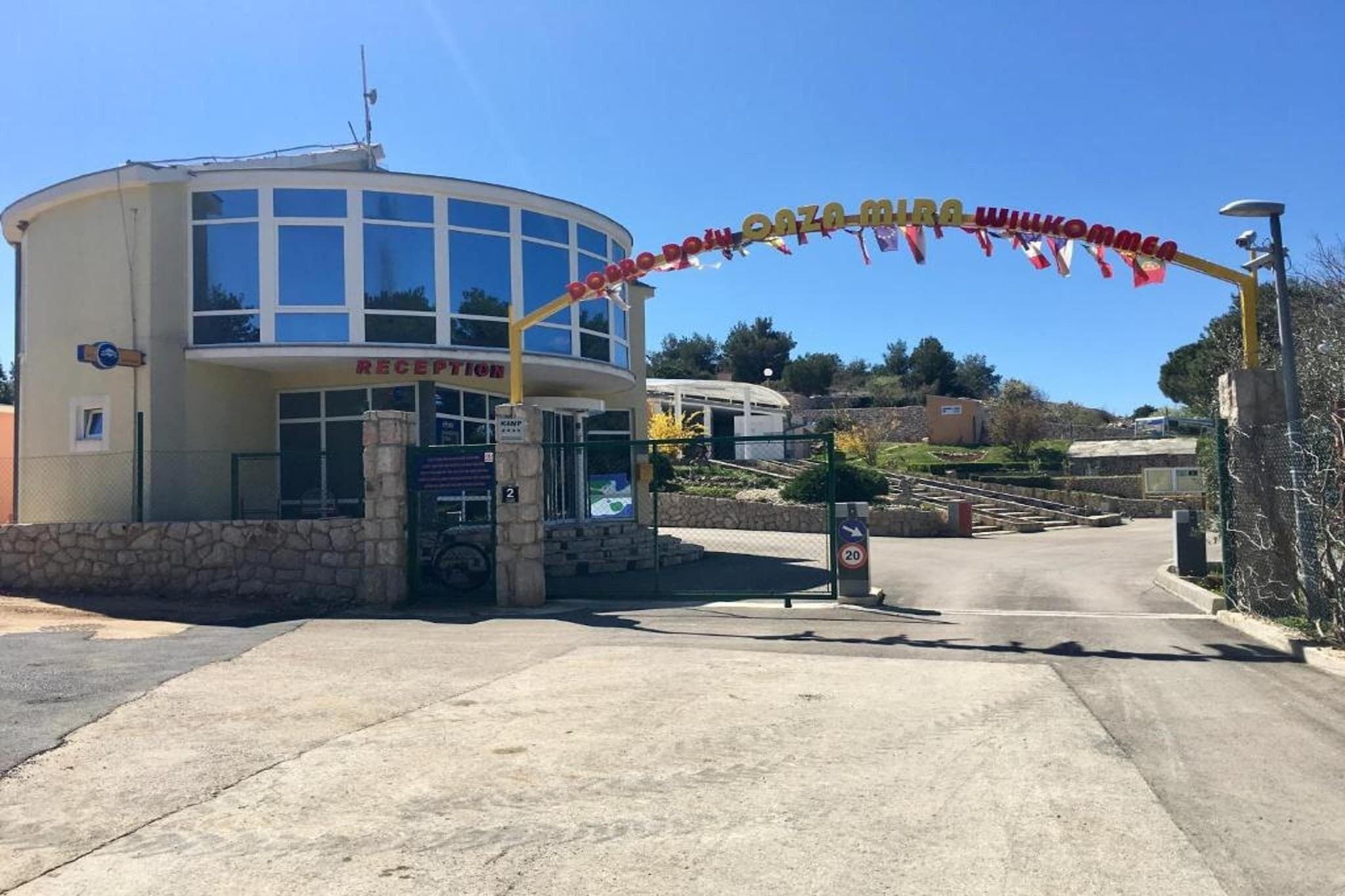 A reception area with a sign reading "RECEPTION" and a speed limit sign of 20.