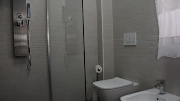 Shower, bidet, towels, soap
