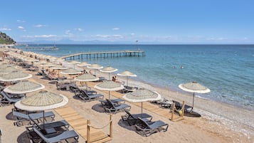 On the beach, beach cabanas, sun-loungers, beach umbrellas