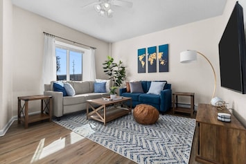 Spacious and comfortable living area with plenty of seating for family and friends. The living area has plenty of natural light!