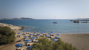 On the beach, sun-loungers