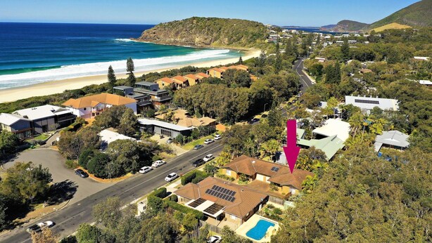 An aerial view of a coastal residential area with houses, a beach, and a road. - Acacia @ Boomerang Beach (Boomerang Beach)