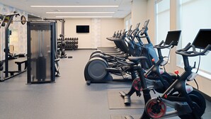 A gym with treadmills, elliptical machines, and weightlifting equipment. - Tru By Hilton Atlanta Airport College Park (College Park)