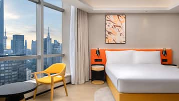 Deluxe Room, 1 King Bed | Down comforters, minibar, in-room safe, desk