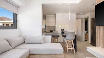 Apartamento luxo | Área de estar | TV de tela plana