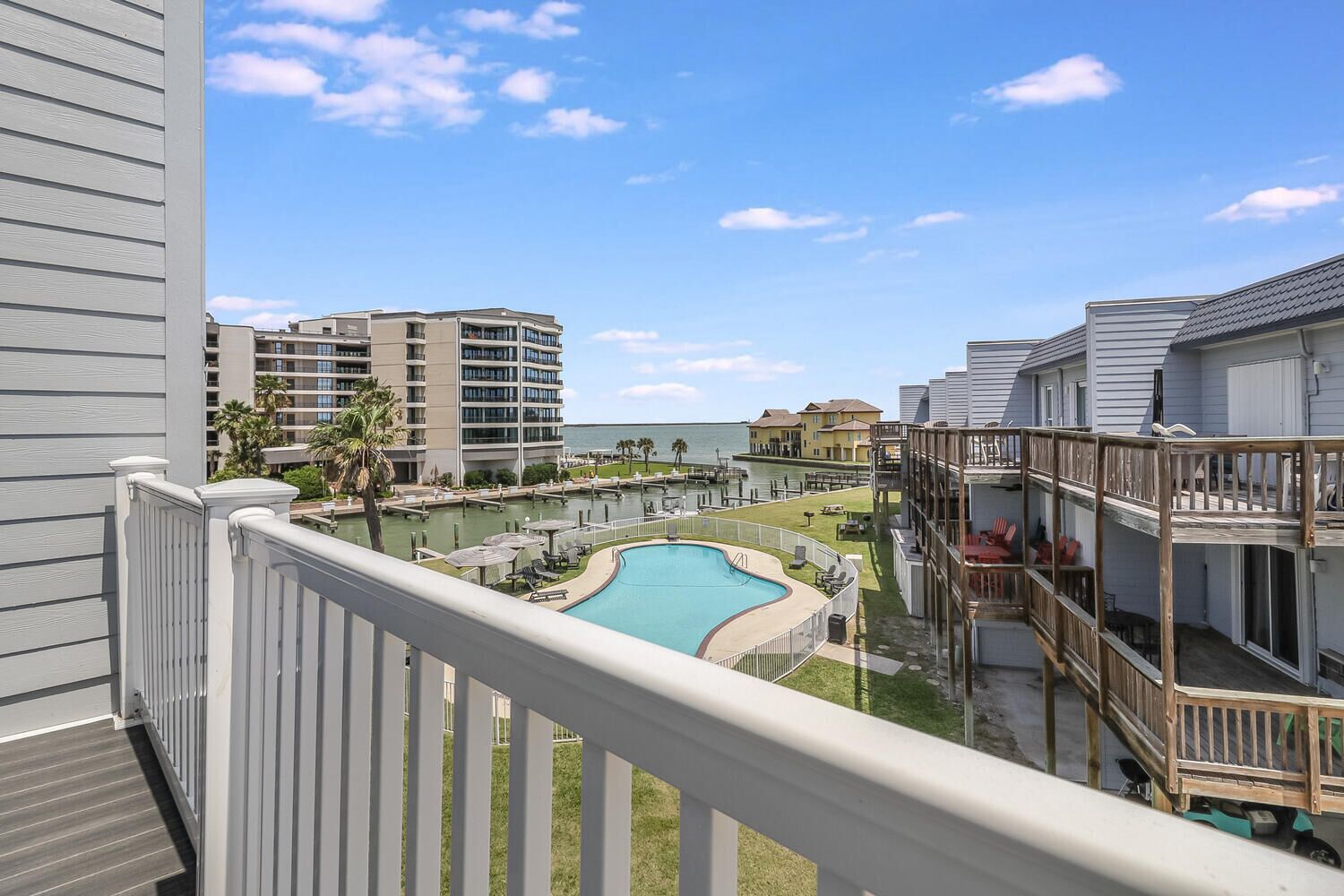 Spacious condo sleeps 8 community pool lighted fishing pier boat slips