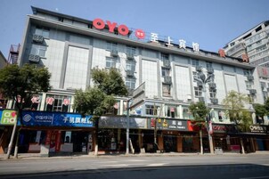 A multi-story building with a prominent 'OYO Hotel' sign at the top.
