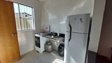 Basic Villa | Private kitchen | Fridge, cookware/dishes/utensils, dining tables