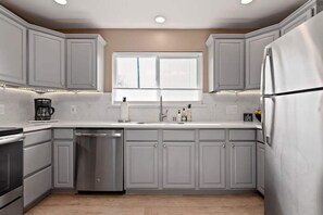 Coffee/tea maker, fridge, microwave, oven