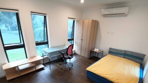 A modern bedroom with a bed, desk, chair, and wardrobe. - A Cozy room in Center of Glen (Glen Waverley)