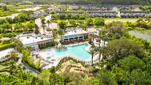 A resort with a swimming pool, lounge areas, and a view of the surrounding landscape. - Blue Harbour Retreat: Private Pool, Free BBQ Grill (Davenport)