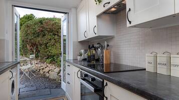 Fridge, oven, toaster, dining tables