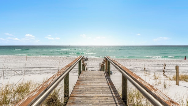 A wooden boardwalk leading to a beach with a clear view of the ocean. - Relaxing 1BR Canal Retreat w/ Beach Access (Destin)