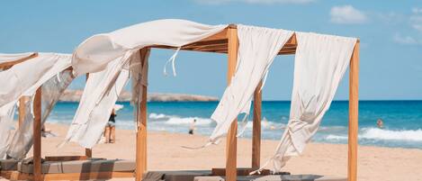 On the beach, sun-loungers, beach towels