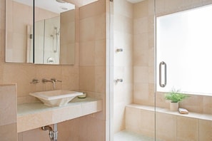 Shower, hair dryer, towels, shampoo
