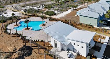 Cypress Sunshine is a 4BD/2BA home steps from north pool & beach boardwalk! Rent onsite golf cart!