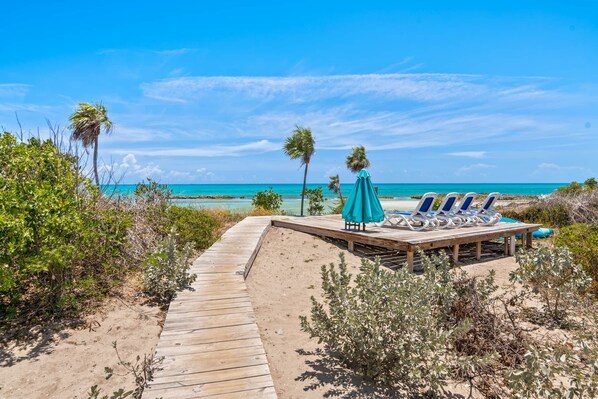 On the beach, sun-loungers, beach towels