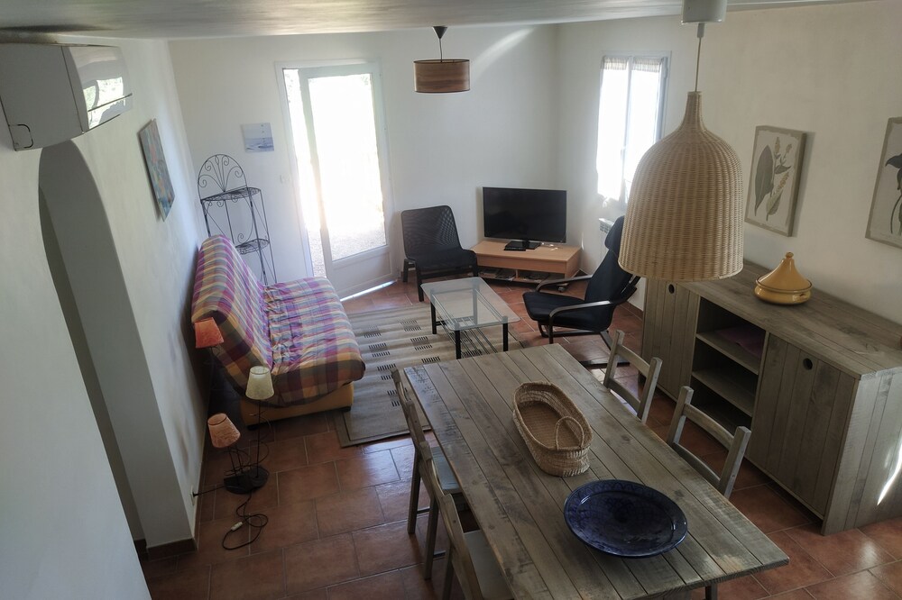 Rural cottage backed by a beekeeping farm