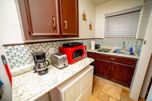 Fridge, microwave, stovetop, coffee/tea maker