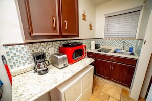 Fridge, microwave, stovetop, coffee/tea maker