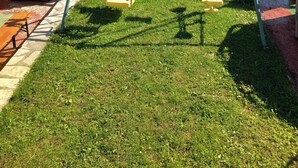 A playground with swings and a stone oven. - Rocky Mountain Triple Room (Prisoje)