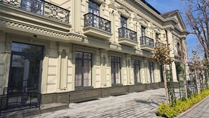 A classical building with ornate balconies and large windows. - WELLFORT HOTEL (Samarkand)