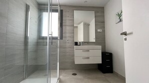 Shower, hair dryer, towels, toilet paper