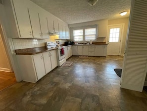 Fridge, coffee/tea maker, cookware/dishes/utensils