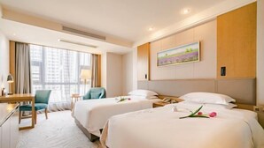 A hotel room with two beds, a desk, a chair, and a painting on the wall. - Century Chanson Hotel (Mianyang)
