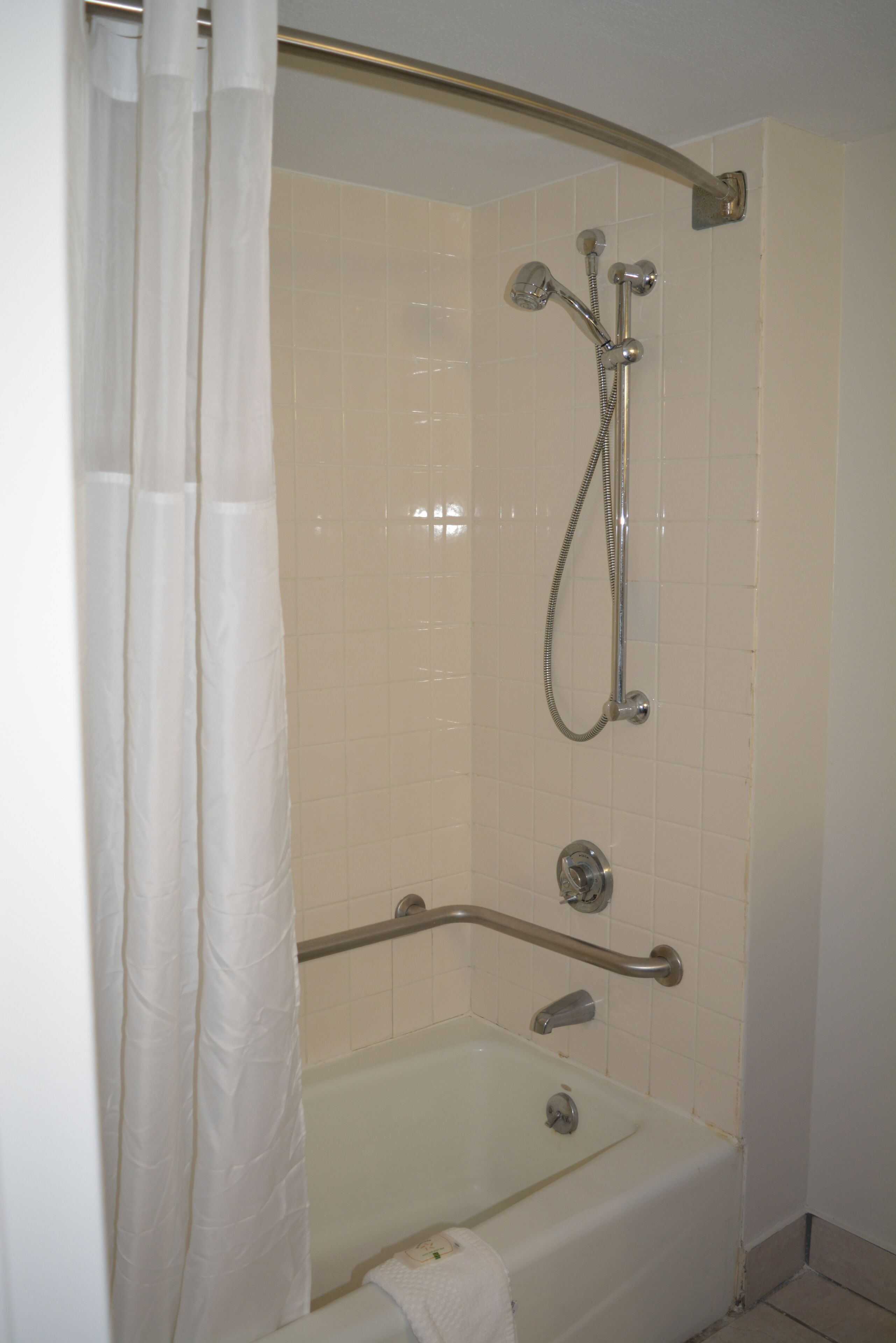 combined shower/bathtub, hair dryer, towels, soap