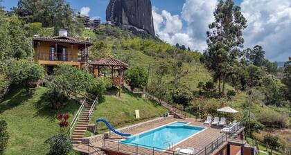 Chiriqui farm in Guatape in front of the Peñol stone