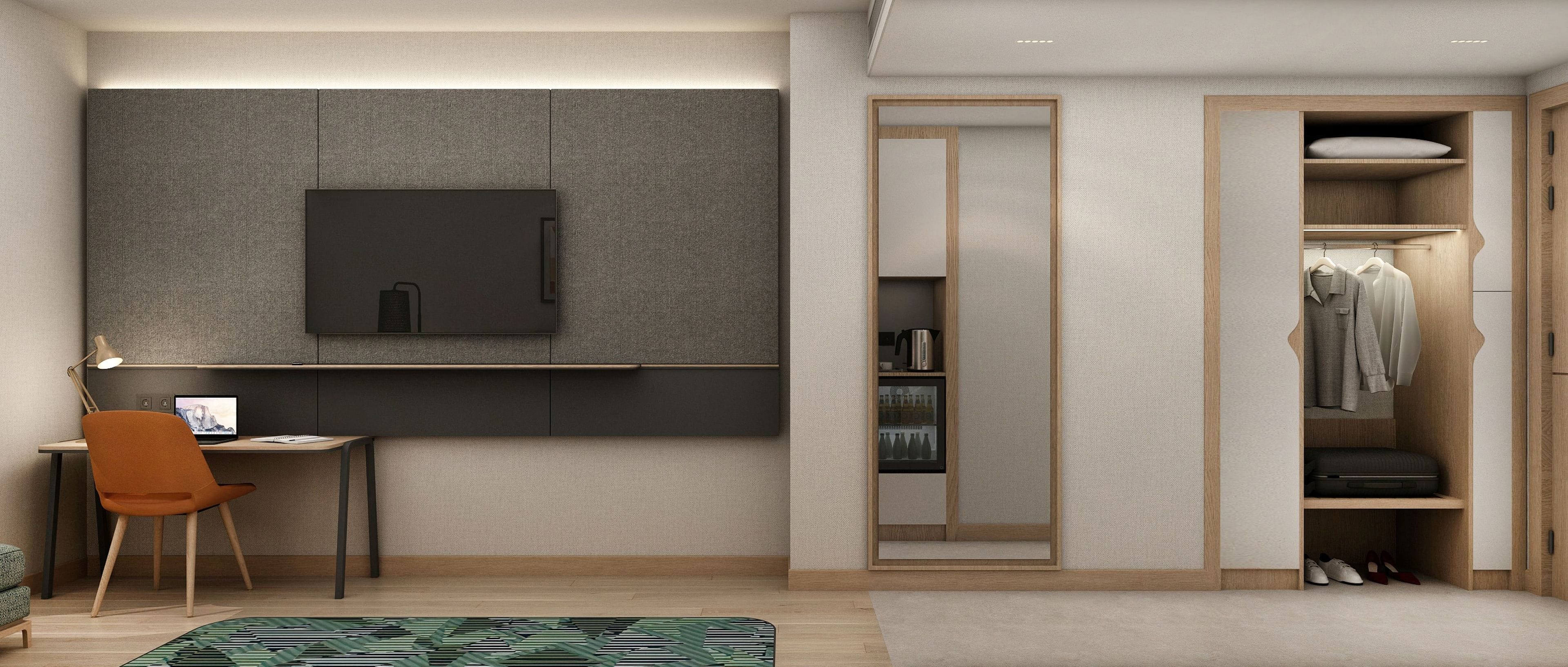 A modern bedroom with a desk, chair, and a wardrobe with a mirror.