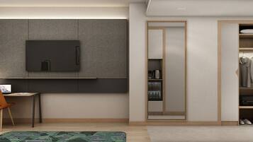 A modern bedroom with a desk, chair, and a wardrobe with a mirror.