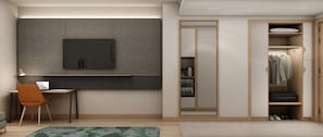 Un dormitorio moderno con un escritorio, una silla y un armario con espejo.