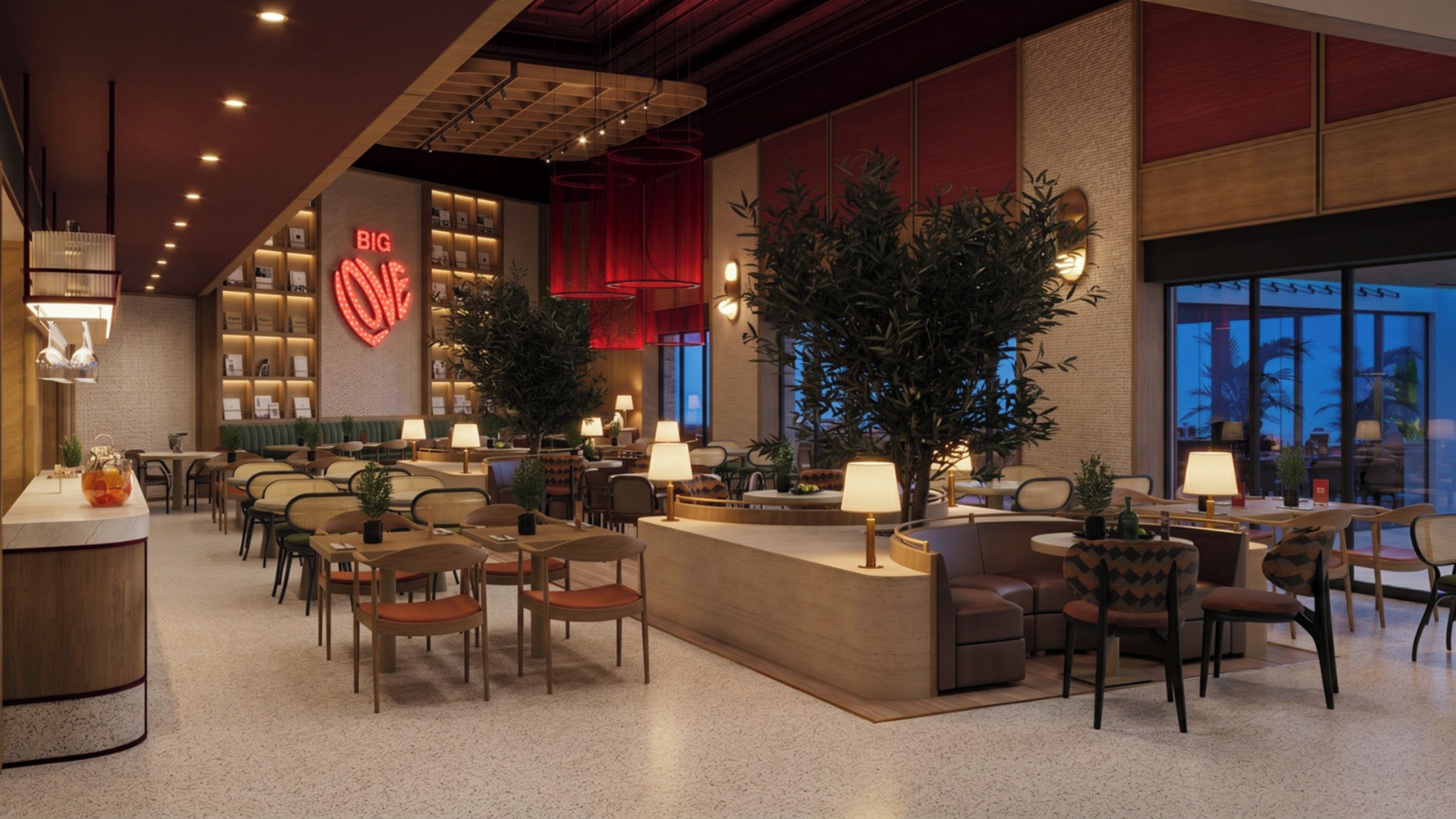 A modern hotel lobby with a reception desk, seating areas, and a large illuminated heart-shaped sign.