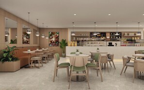 A modern cafe interior with round tables and chairs, a coffee bar in the background, and plants as decor. - Holiday Inn & Suites Kocaeli - Dilovasi Gulf View by IHG (Dilovasi)