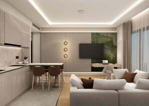 A modern living room with a sofa, a dining area with chairs, a flat-screen TV mounted on the wall, and a kitchen area with a countertop and cabinets. - Holiday Inn Hotel And Suites Kocaeli Dilovasi Gulf View by IHG (Dilovasi)