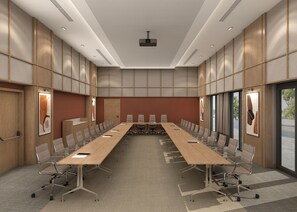 A conference room with a long table, chairs, and a projector. - Holiday Inn Hotel And Suites Kocaeli Dilovasi Gulf View by IHG (Dilovasi)