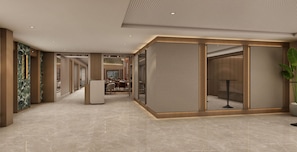 A modern hotel lobby with a marble floor, a reception desk, and a dining area visible through a glass partition. - Holiday Inn Hotel And Suites Kocaeli Dilovasi Gulf View by IHG (Dilovasi)
