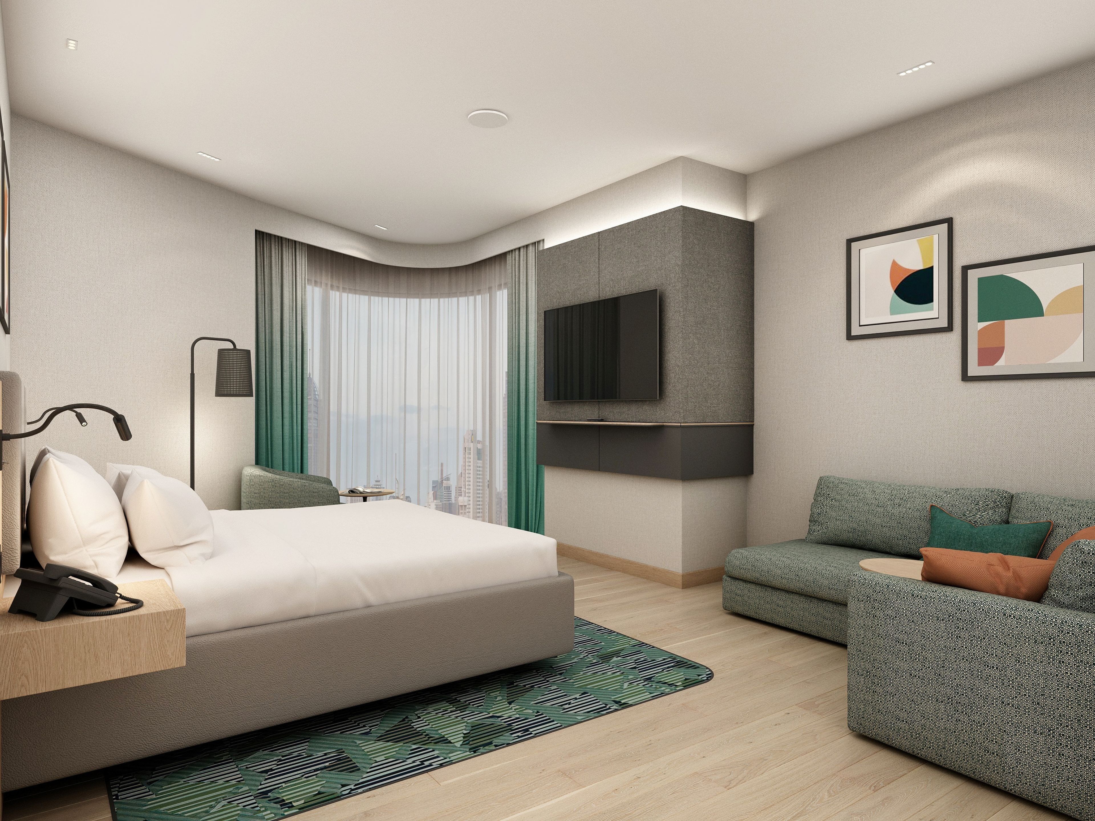 A modern hotel room with a bed, a sofa, a flat-screen TV, and a city view.