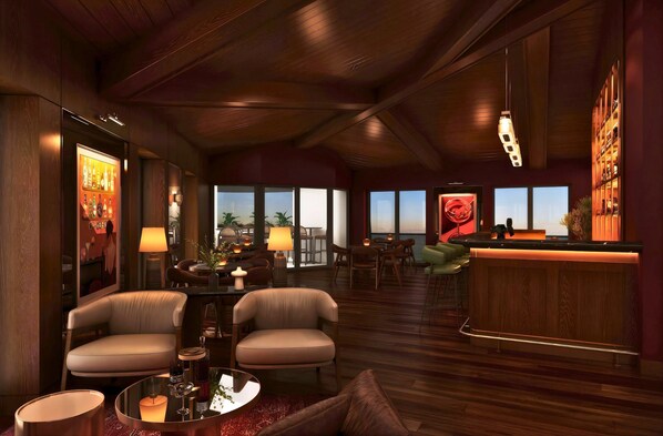 A spacious lounge area with a bar, seating arrangements, and large windows providing views. - Holiday Inn & Suites Kocaeli Dilovası Gulf View by IHG (Dilovasi)