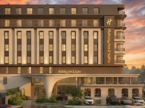 A modern hotel building with a prominent entrance, multiple balconies, and a clear sign indicating it is a Holiday Inn & Suites. - Holiday Inn Hotel And Suites Kocaeli Dilovasi Gulf View by IHG (Dilovasi)