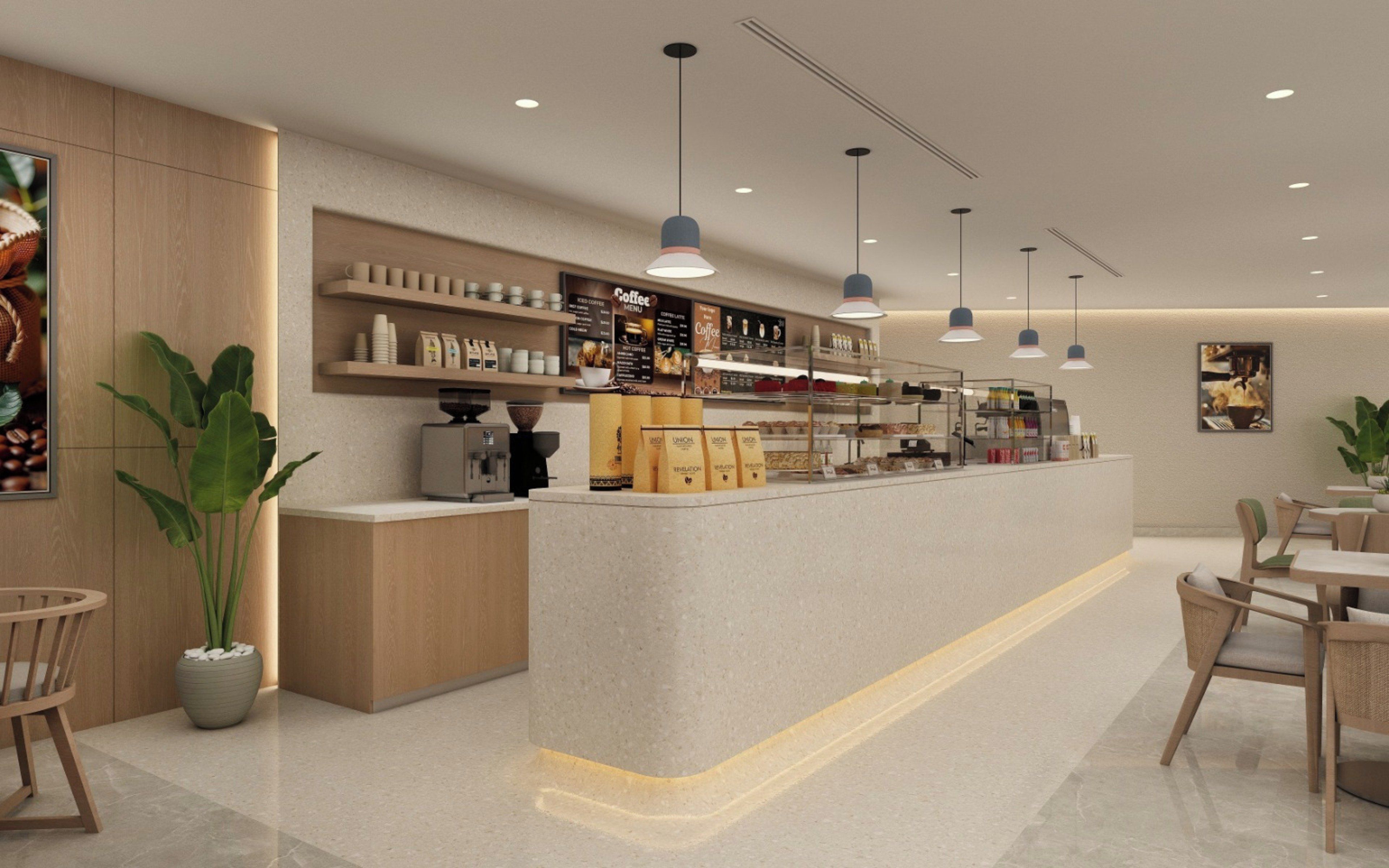 A modern coffee shop interior with a counter, seating area, and various coffee-related items on display.