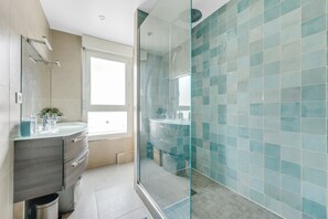 Shower, hair dryer, towels, soap
